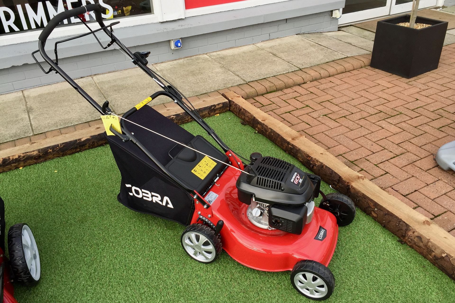 Photograph of a Cobra rotary mower with Honda GCV engine, taken at Cyril Johnston, Belfast, United Kingdom.