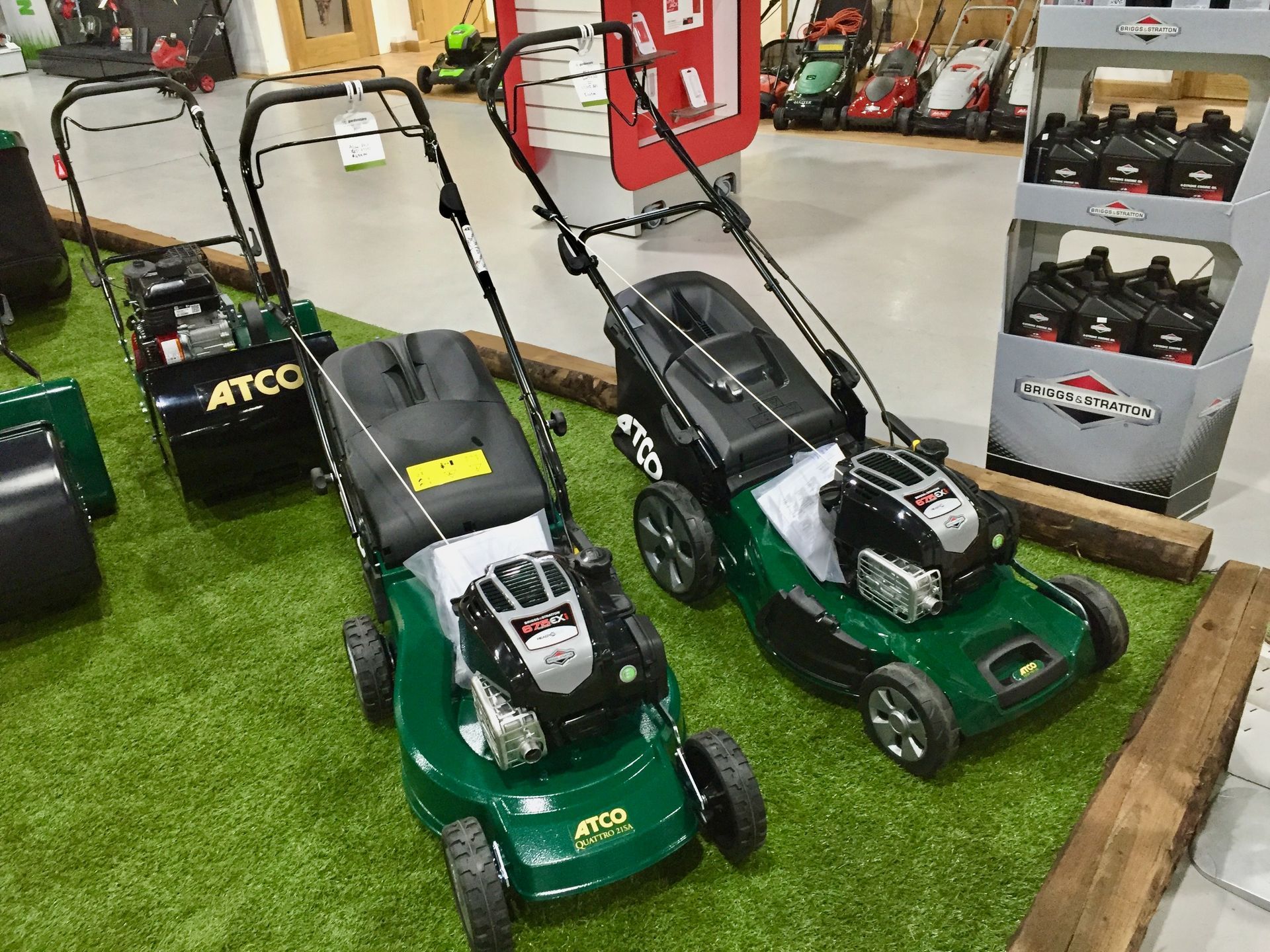 A selection of Briggs & Stratton engined ATCO lawnmowers, on sale at Cyril Johnston, Belfast, UK.