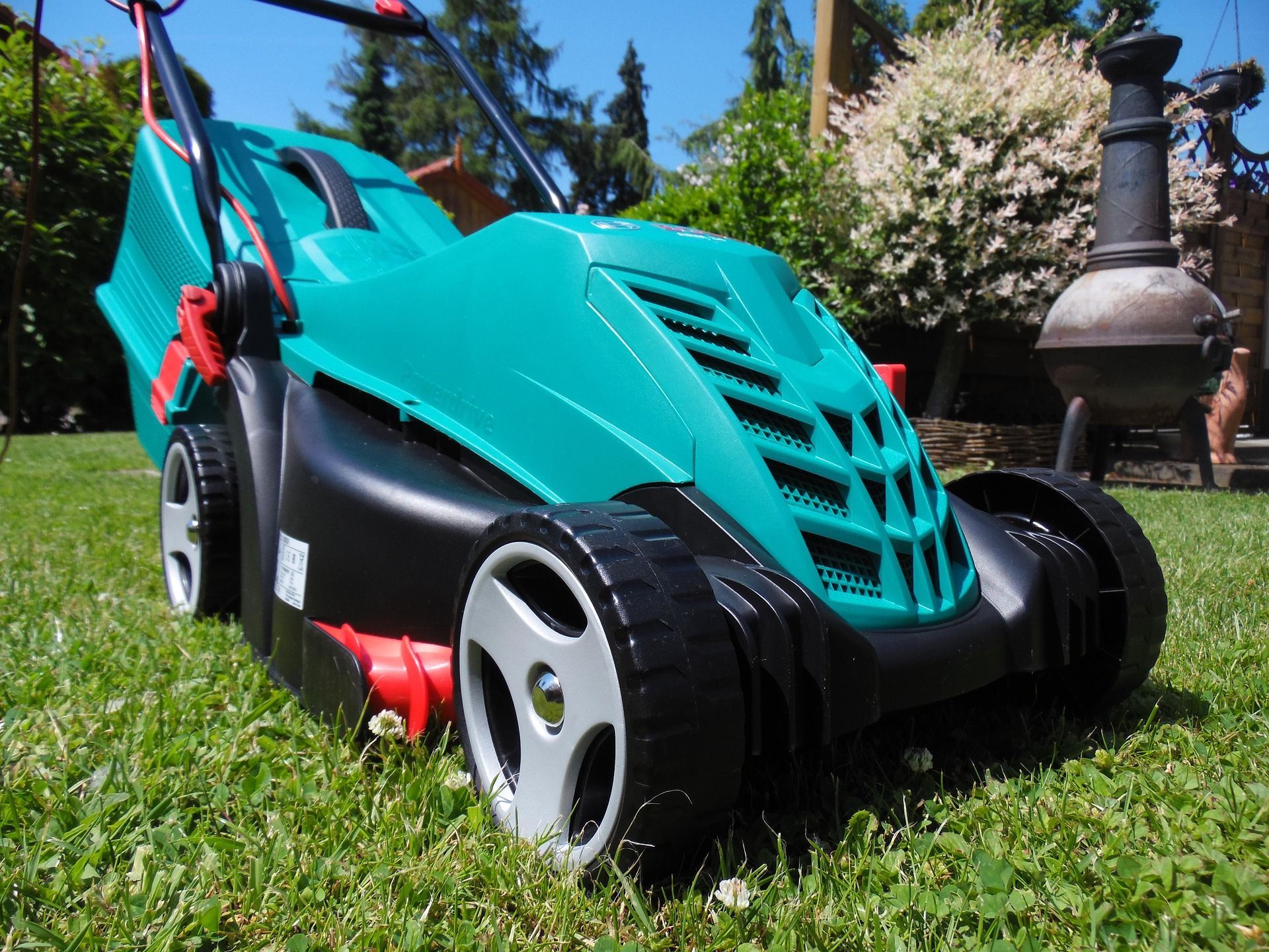 Photograph of a Bosch corded electric lawn mower.