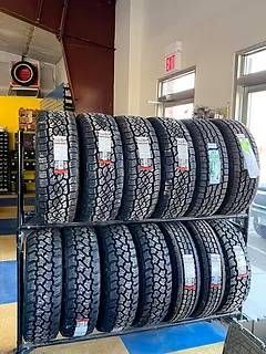 Tire rack in showroom | Stuart's Hometown Auto