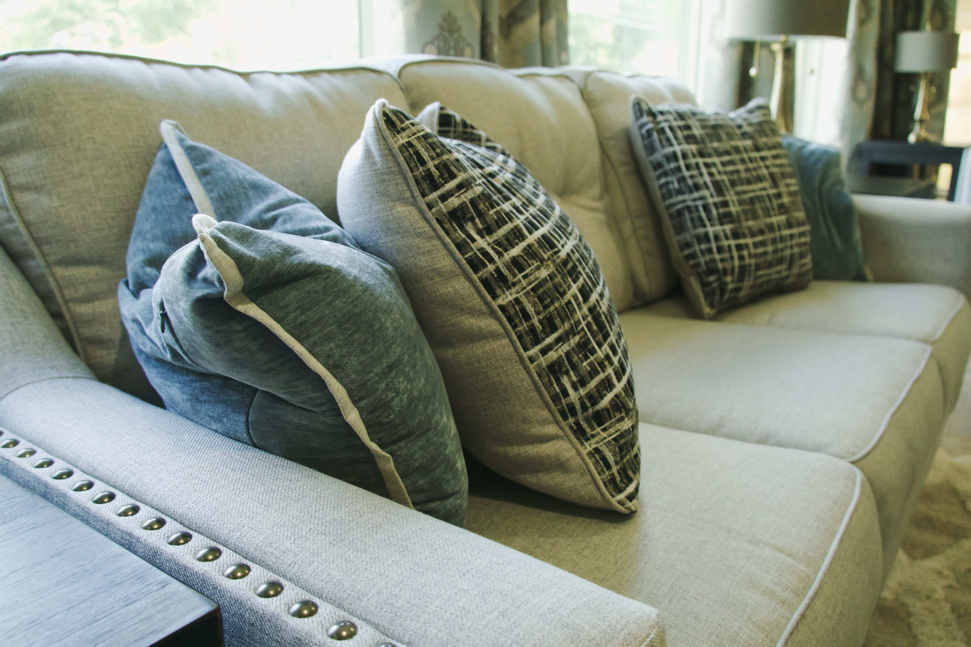 A living room with a couch and pillows on it