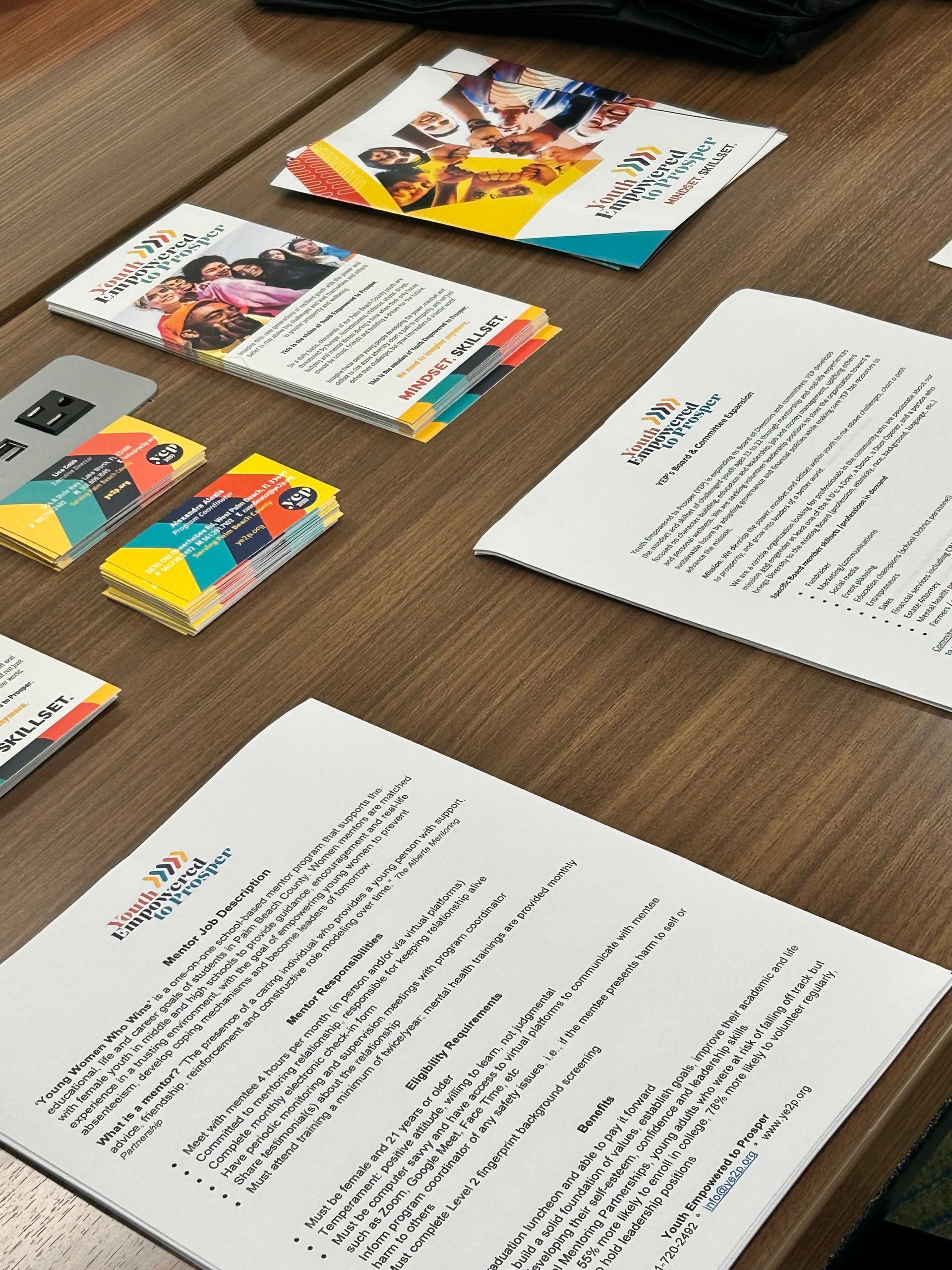 papers and business cards displayed on a table