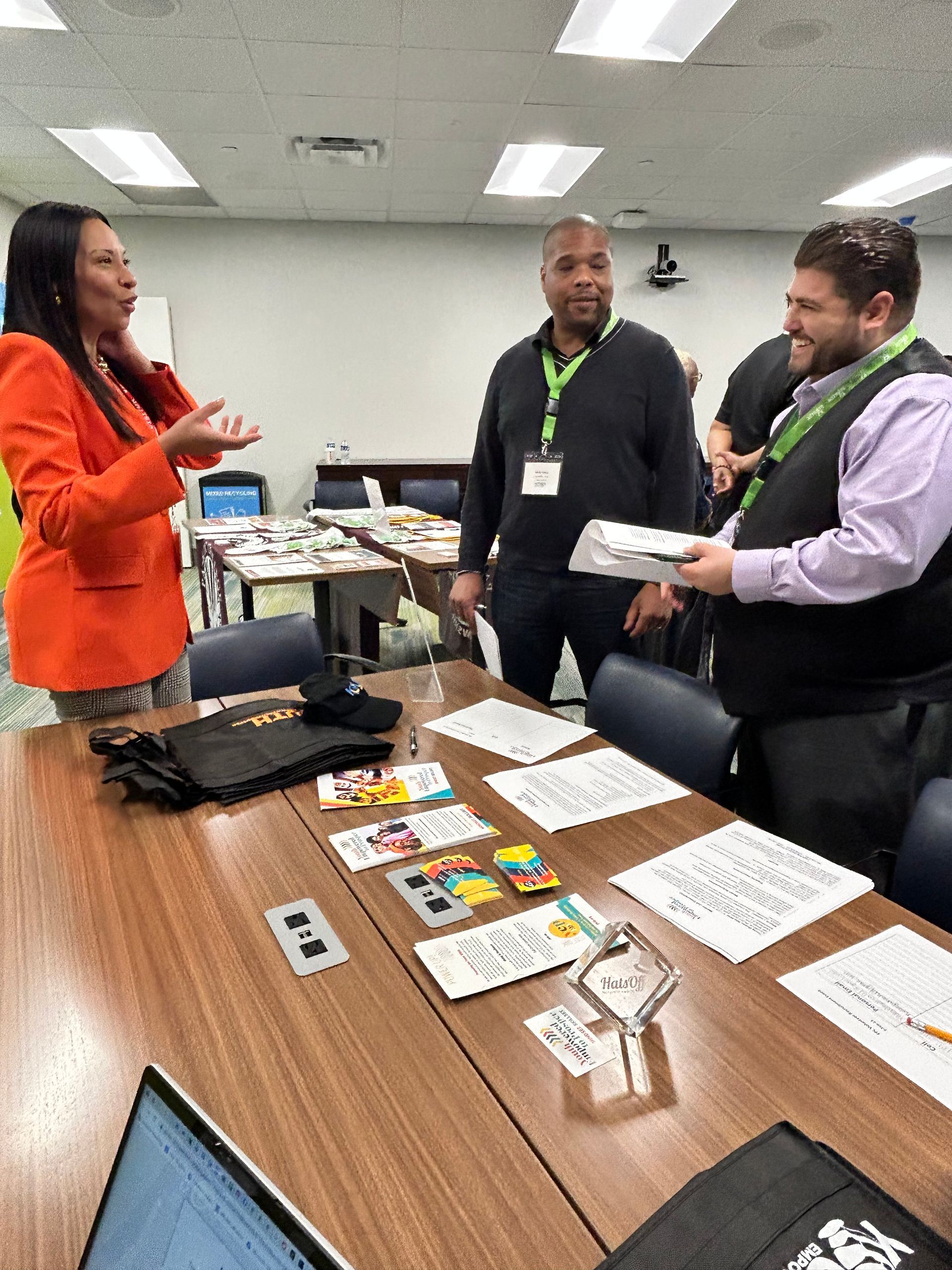 three people engaged in a conversation