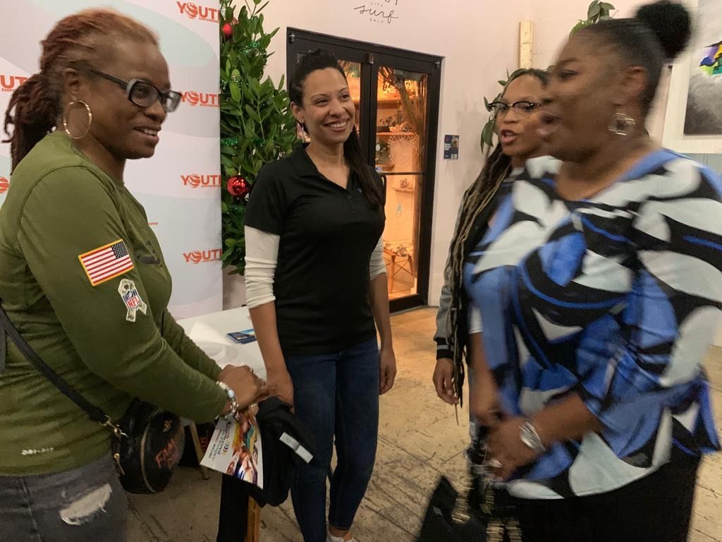 three women having a conversation