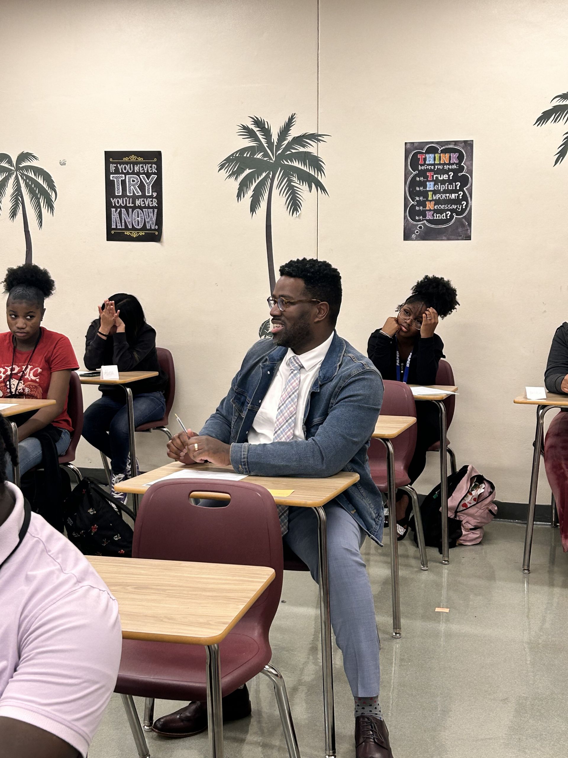 students sitting in classroom at desks