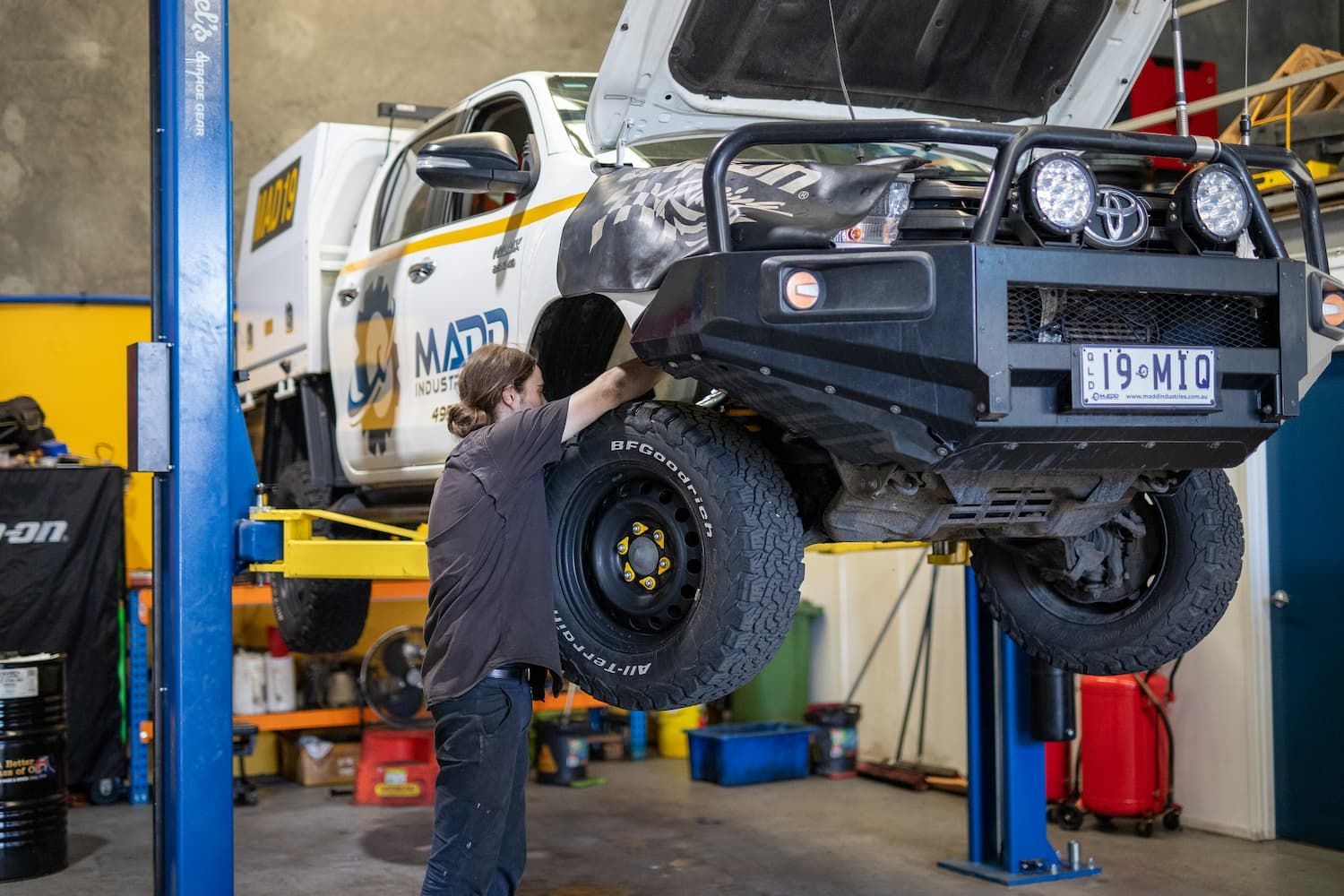 Fitter Realigning the Wheels — MADD Mechanical in Paget, QLD