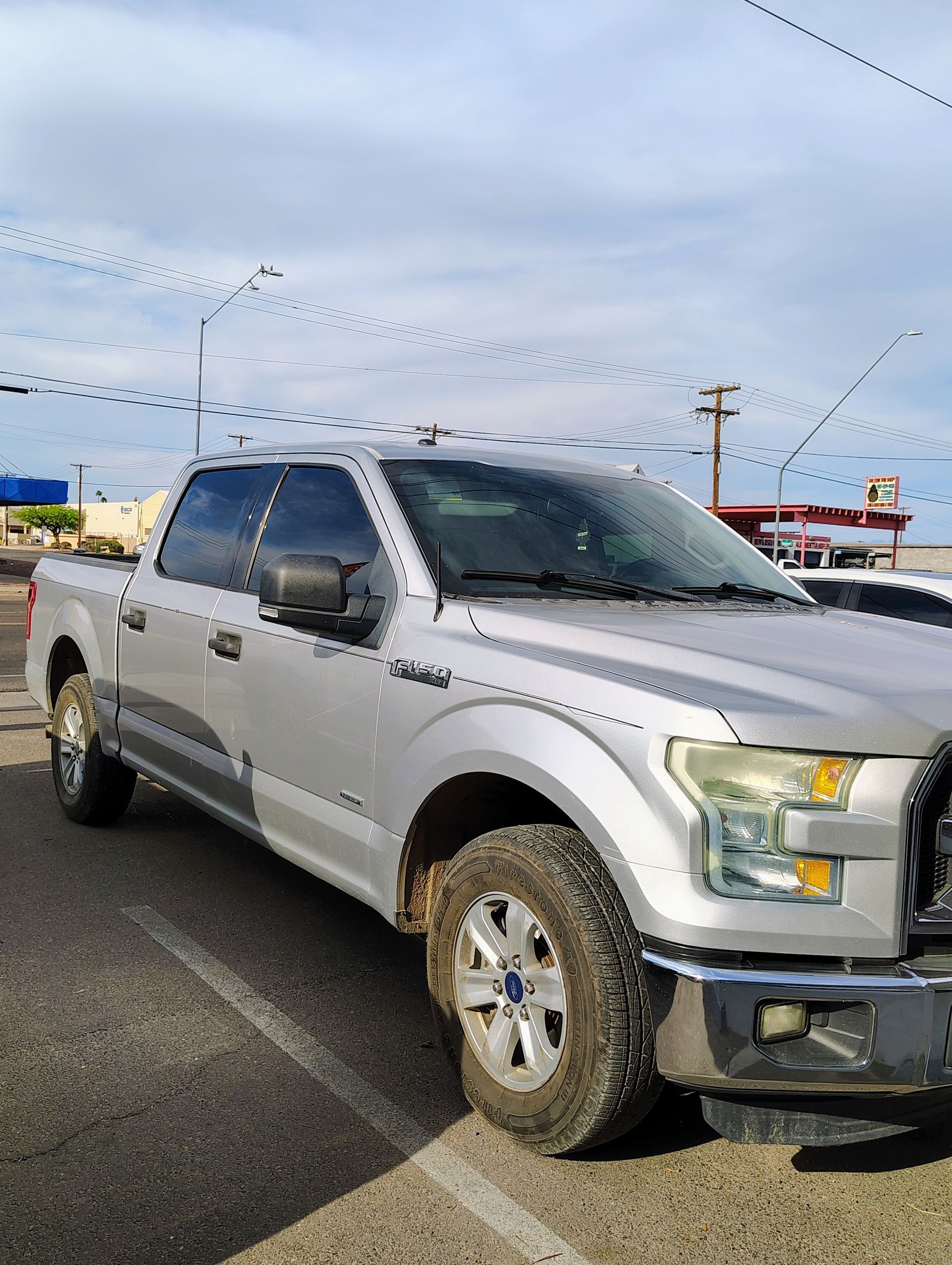 A car with a black window is sitting in a garage.