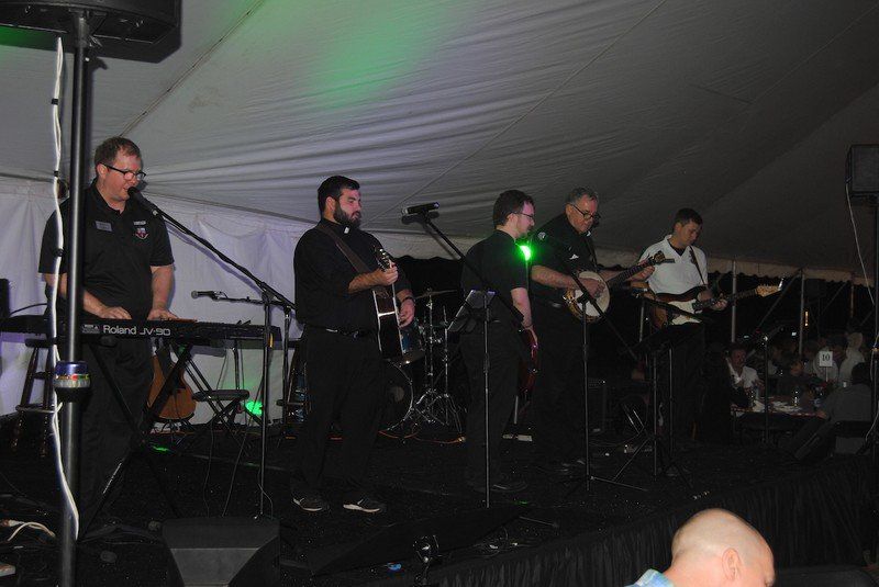 Priests play music for attendees.