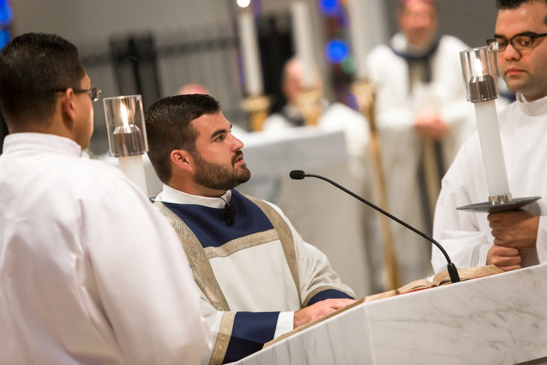 Priest giving mass at gala