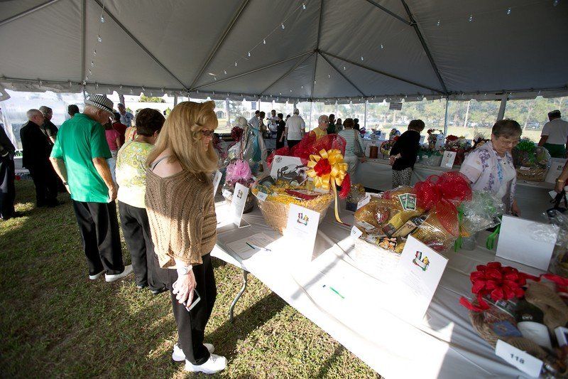 Attendees place bids at silent auction.
