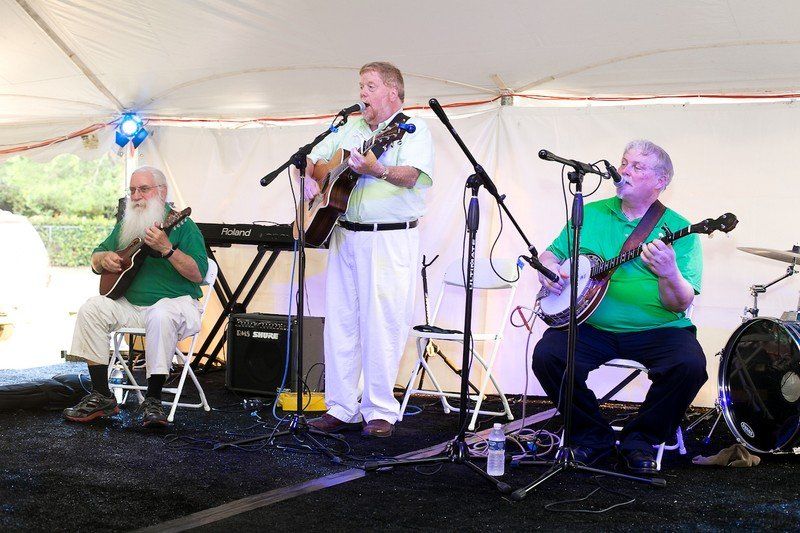 Man plays guitar and sings.