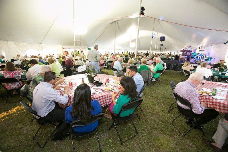 Group of people eating dinner.