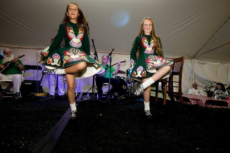 Two girls perform traditional dance.