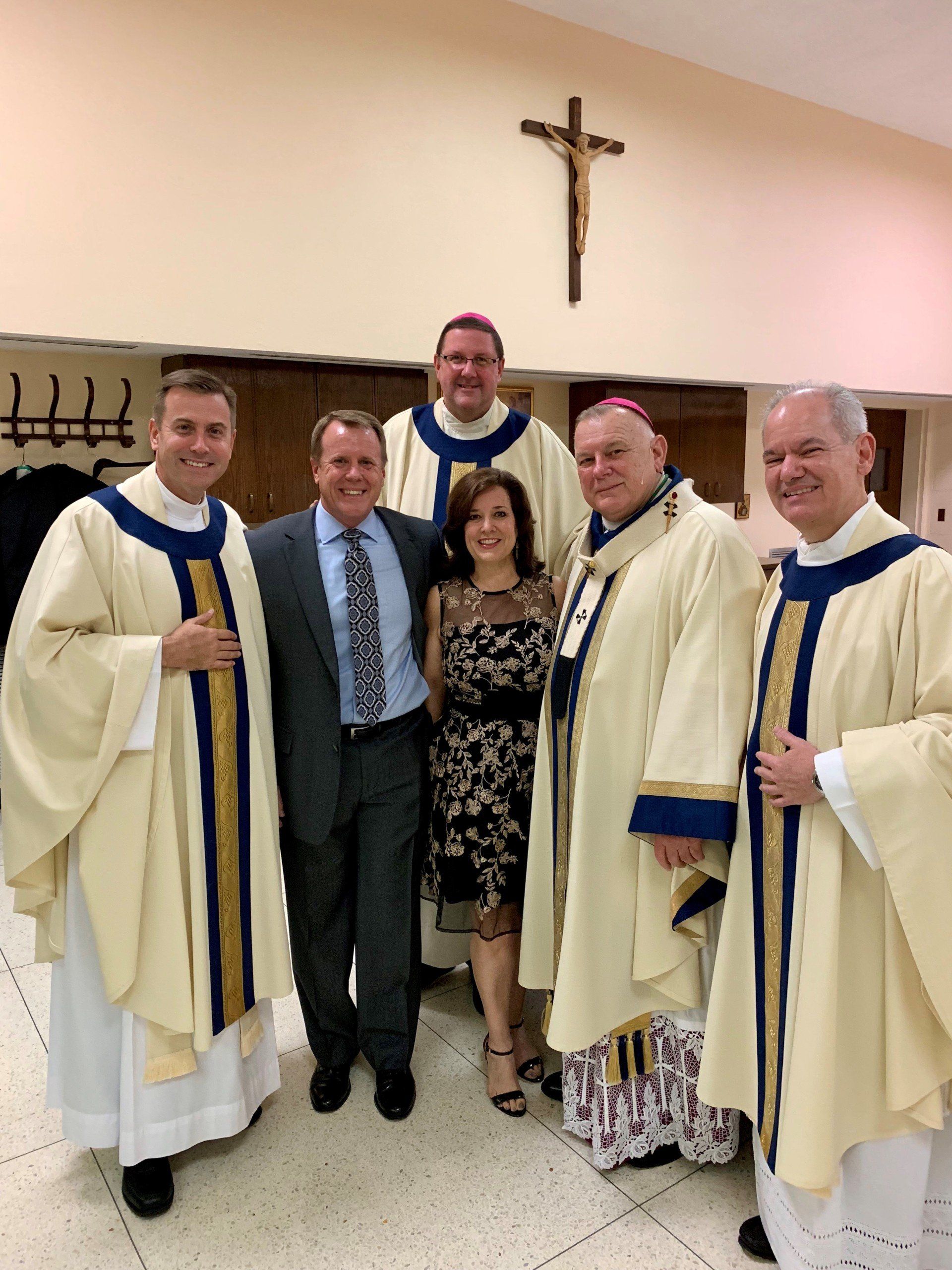 Couple with four priests at St. Vincent’s Mission at Annual Gala