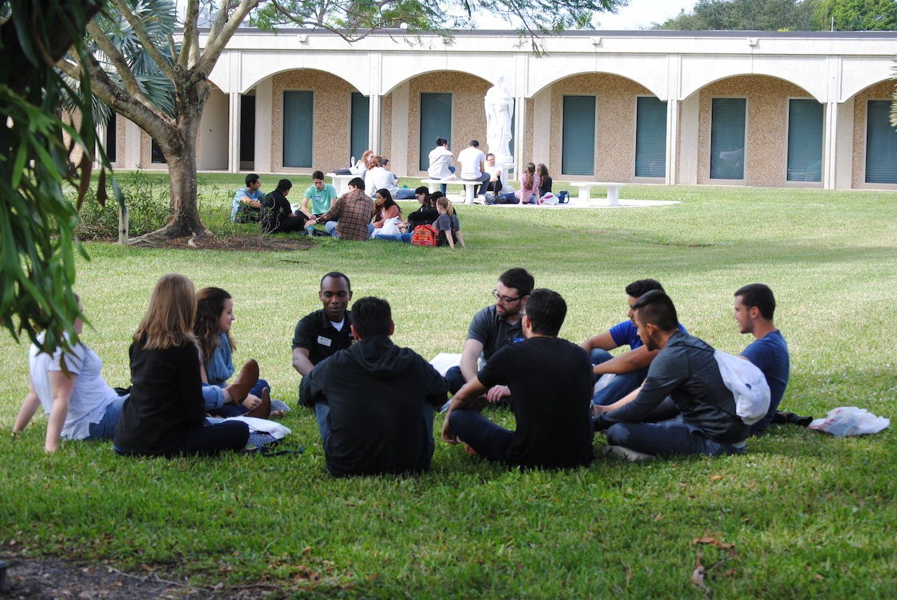 Young adult retreat attendees participate in small group discussions with seminarians.