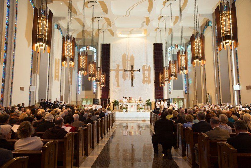 Sunday Mass in progress, church is full of parishners.