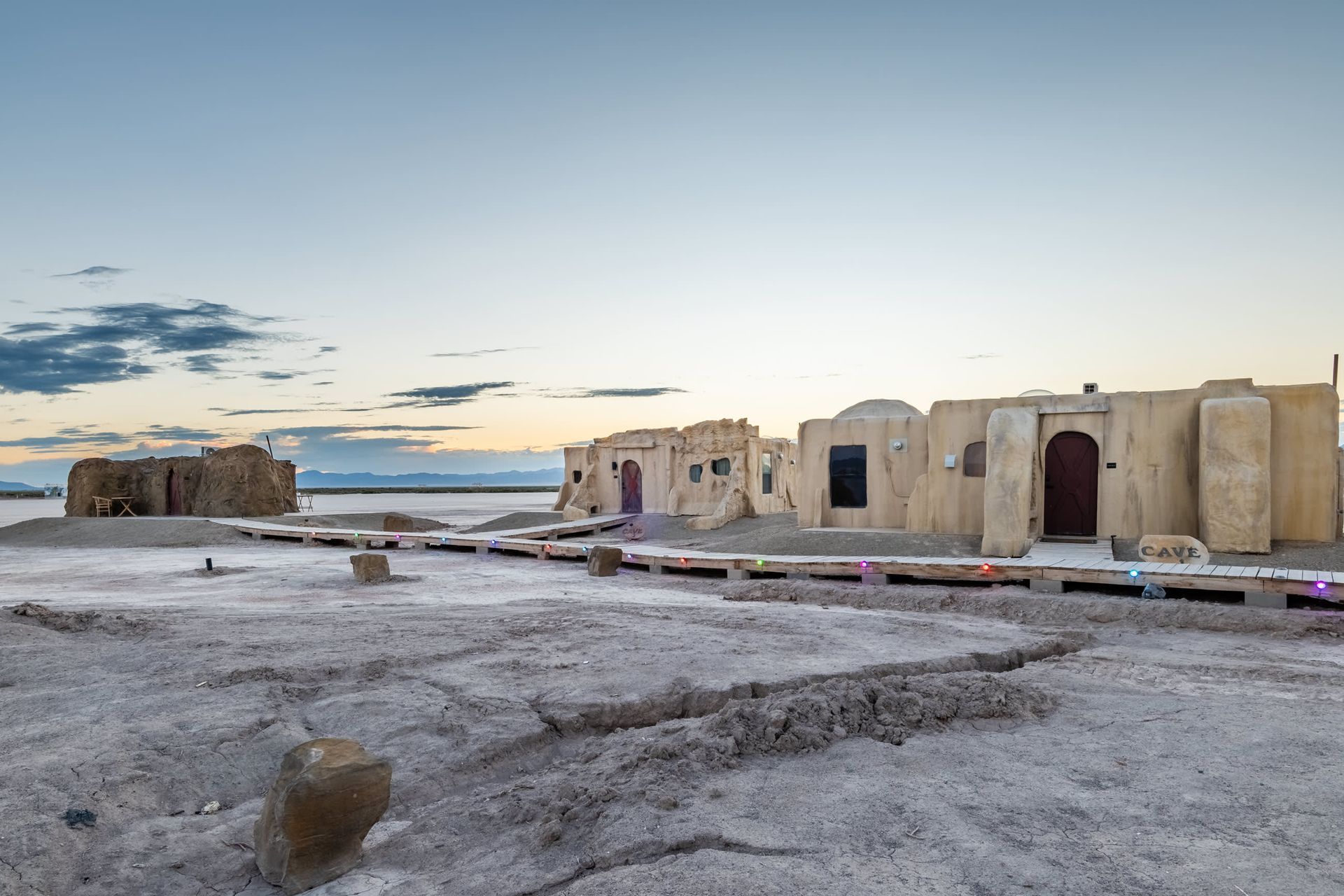 A group of buildings in the middle of a desert.