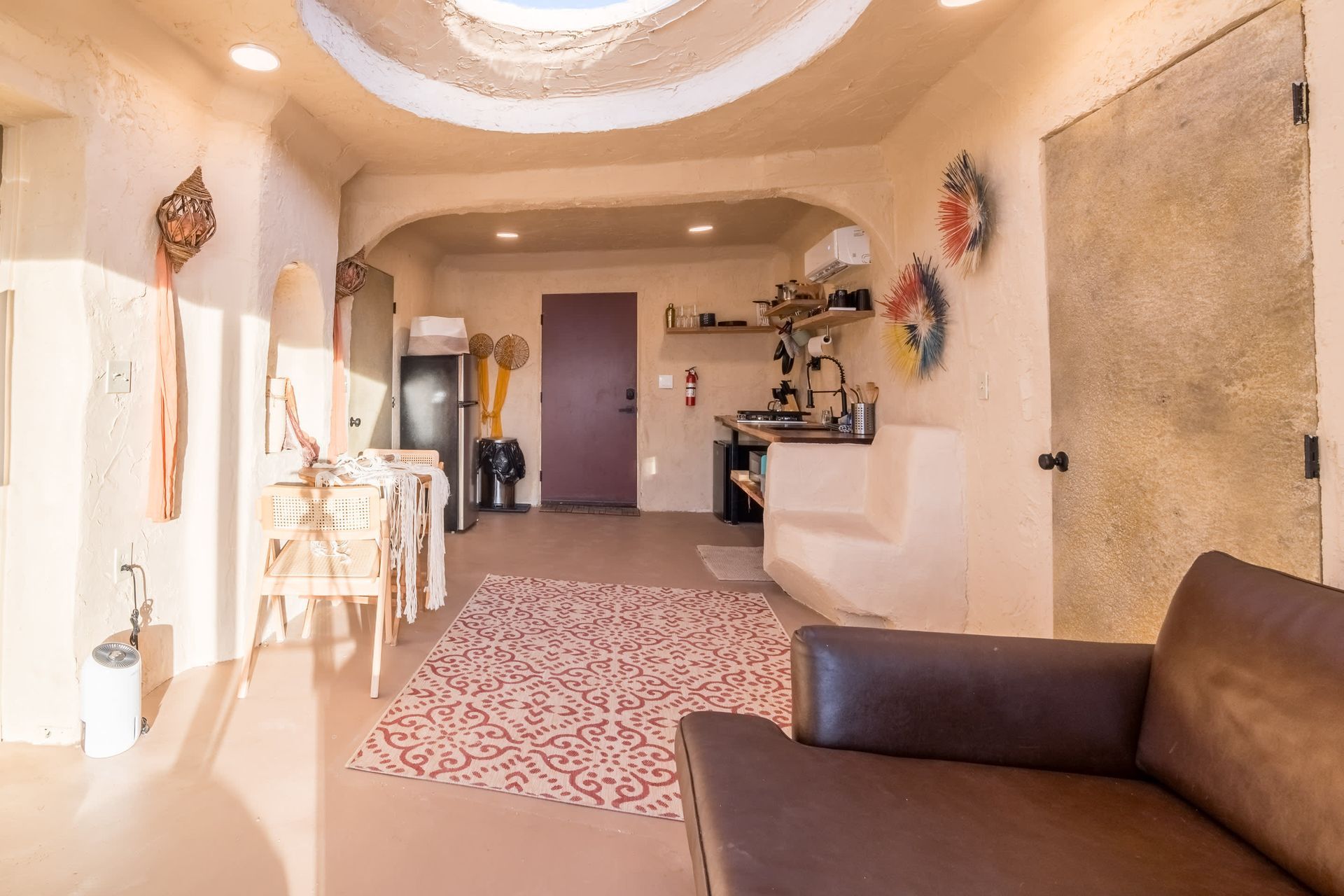 A living room with a couch and a rug