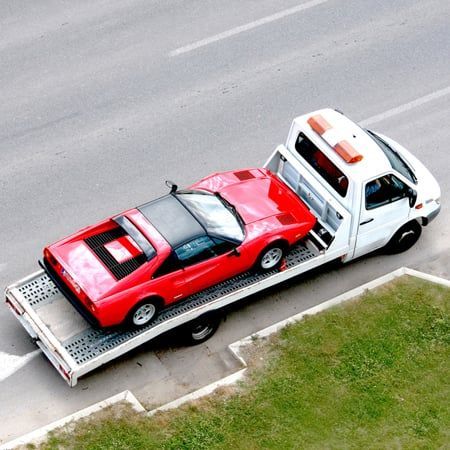 A car being moved by a towing company serving Lima, NY