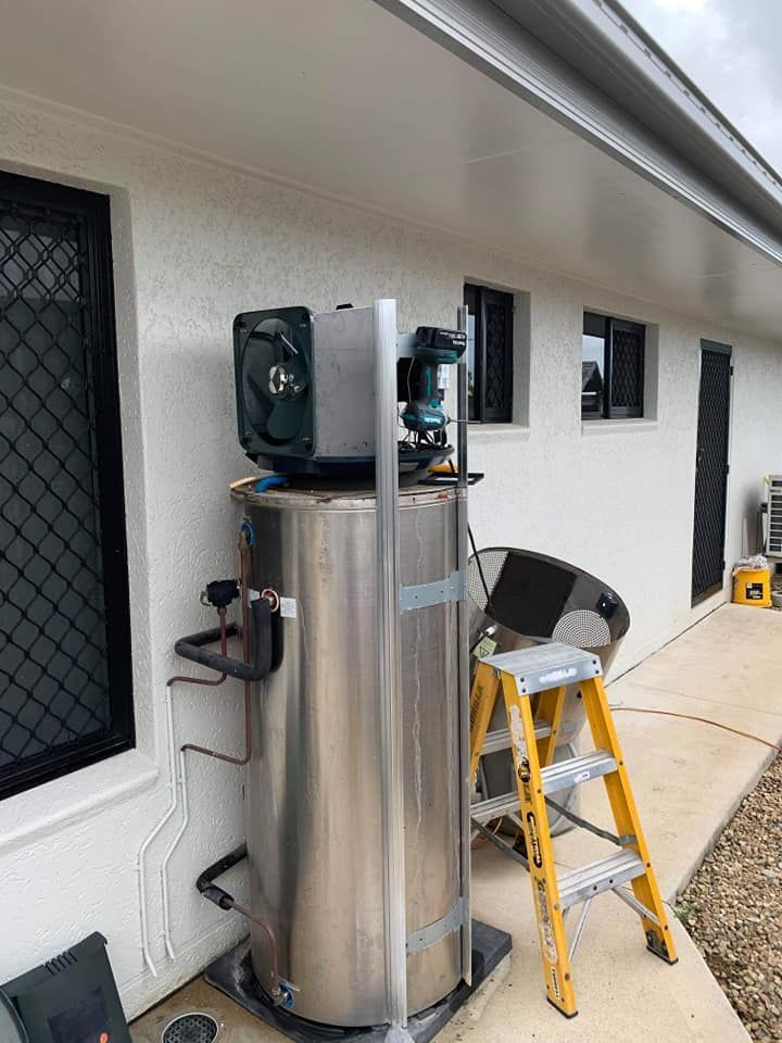 Stainless Steel Water Heater With a Motor and Fan on Top — Vantage Plumbing and Drainage In Pacific Pines, QLD