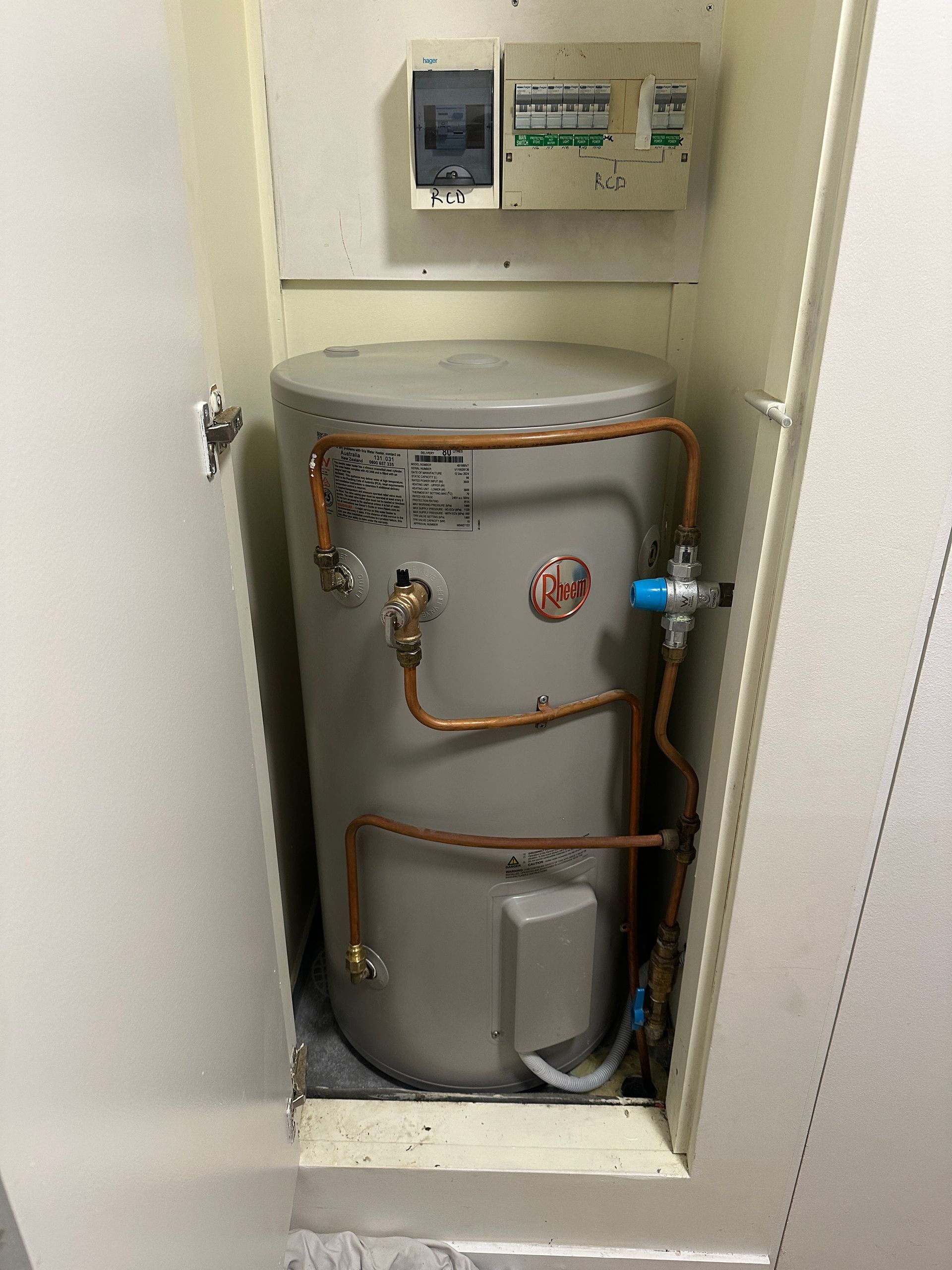 Water Heater Enclosed in a Cabinet — Vantage Plumbing and Drainage In Oxenford, QLD