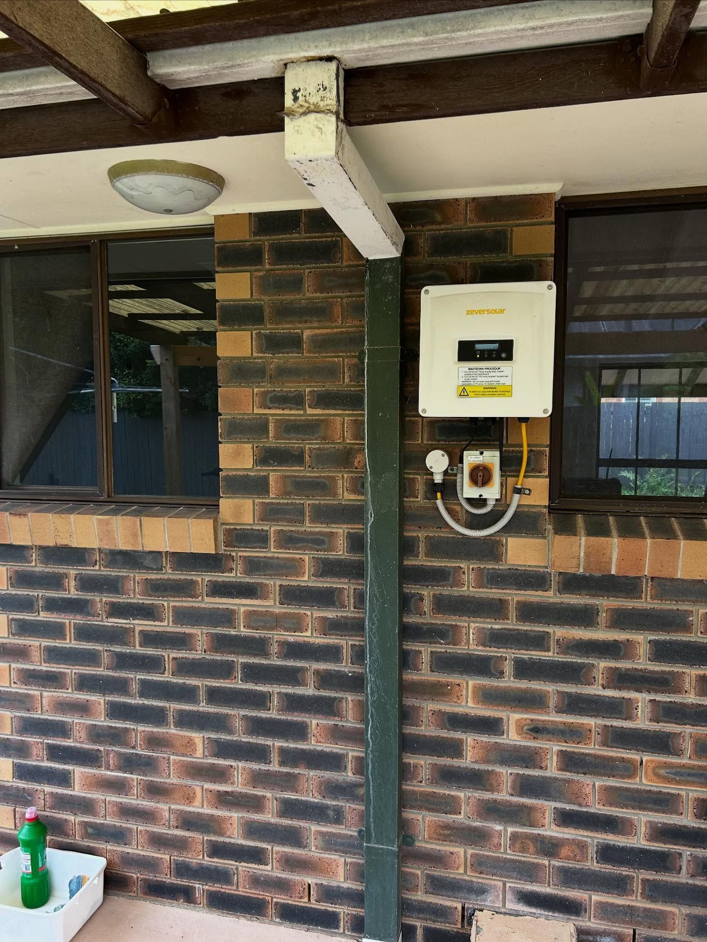 Brick Wall With Solar Panel Equipment — Vantage Plumbing and Drainage In Nerang, QLD