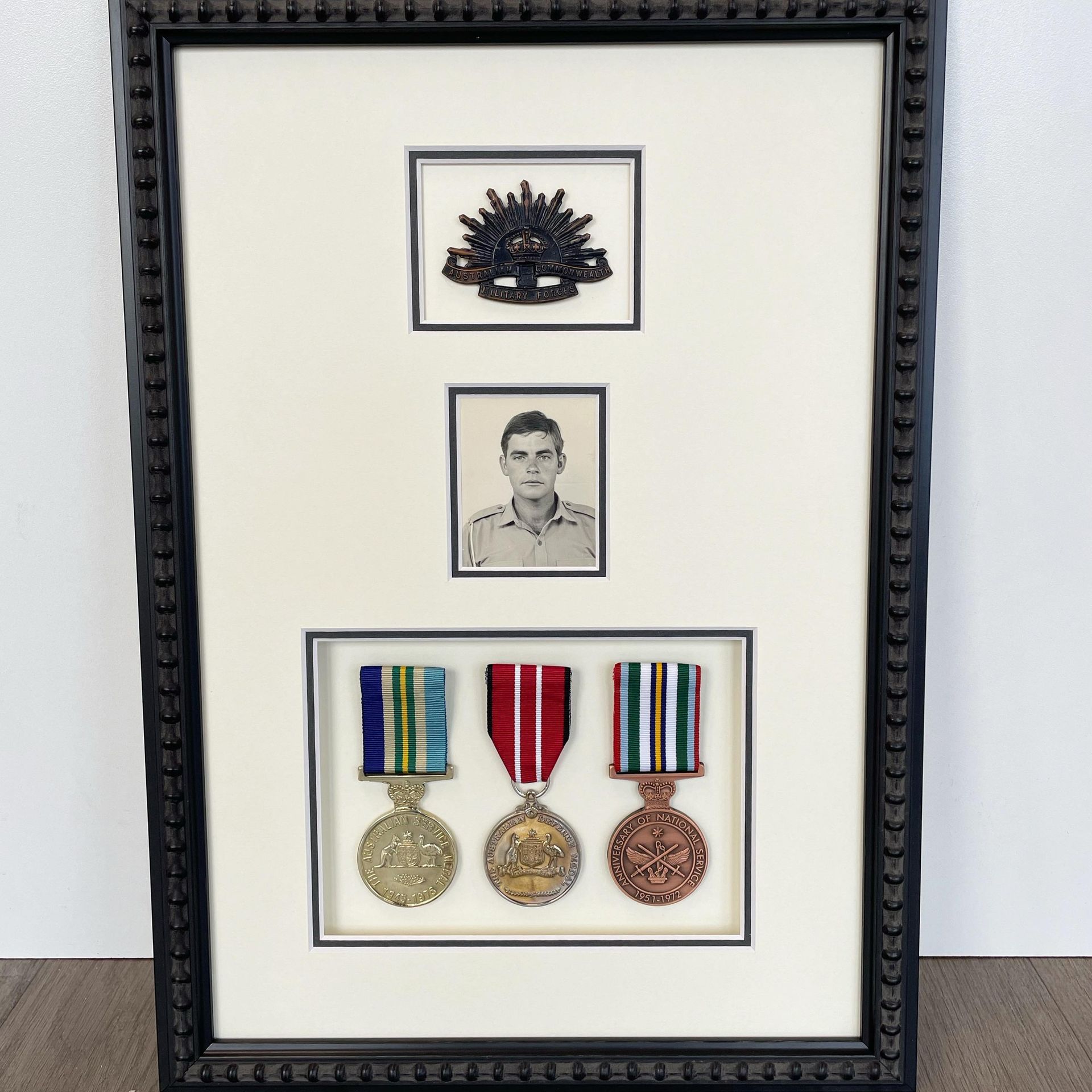A Bunch of Medals with Red Stones on Them — Framing Alternative in Erina Heights, NSW
