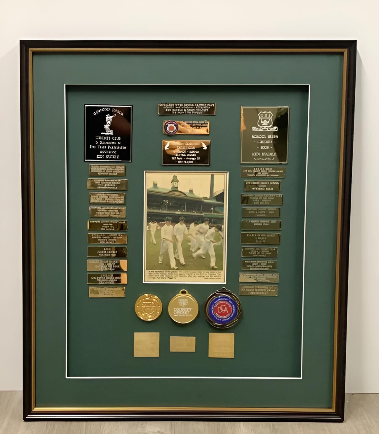 A Framed Picture with A Picture of A Group of People and Medals — Framing Alternative in Erina Heights, NSW