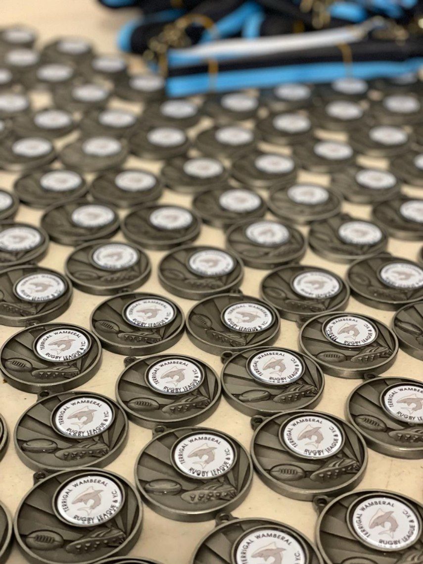 A Bunch of Medals Are Sitting on A Table — Framing Alternative in Erina Heights, NSW