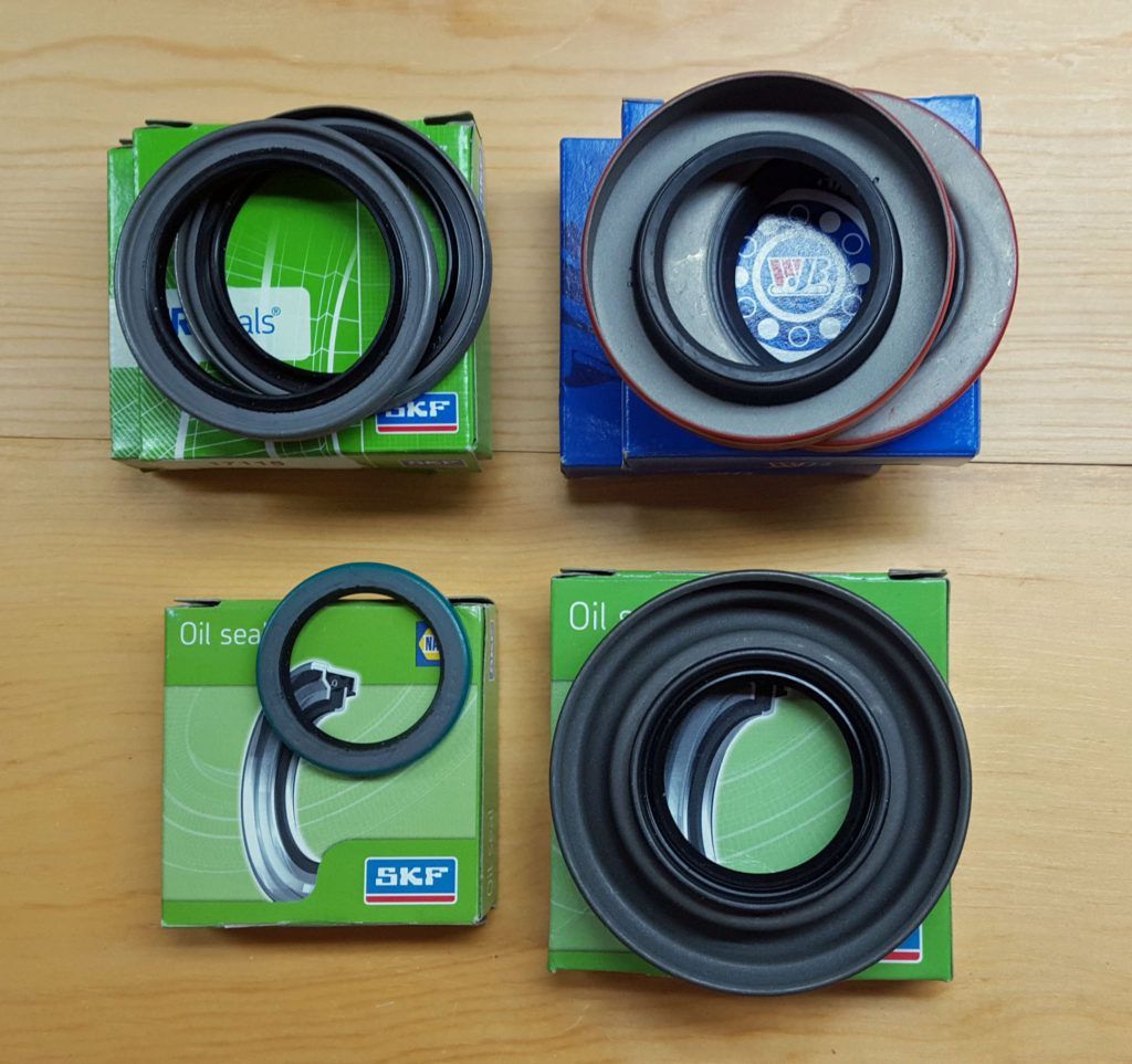 Four SKF oil seal boxes, each with a different seal displayed on top.