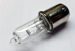 A clear, cylindrical halogen light bulb with a silver base, seen against a white background.