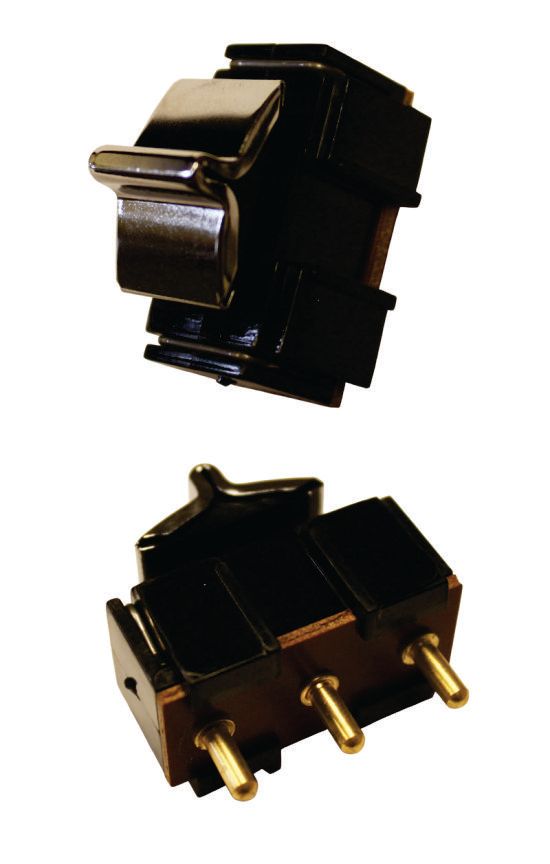 Two black, rectangular electrical switches. One shows the top with a silver lever, the other shows the bottom with three golden pins.