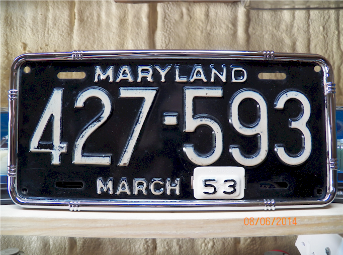 Maryland license plate with black background, white text 