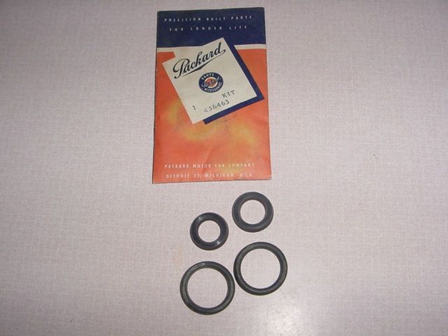 A set of black rubber rings with a vintage package labeled 