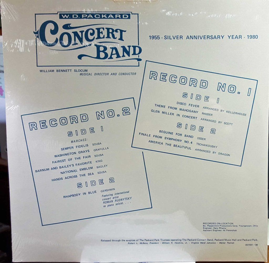 A white vinyl record album cover with blue text and a logo for the W.D. Packard Concert Band, featuring song listings for two records.