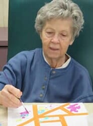 Creative senior doing art — contact services in Parma, OH