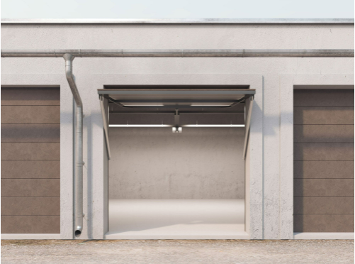 A garage door is open and a drainpipe is hanging from the side of a building. A garage door is open and a drainpipe is hanging from the side of a building.