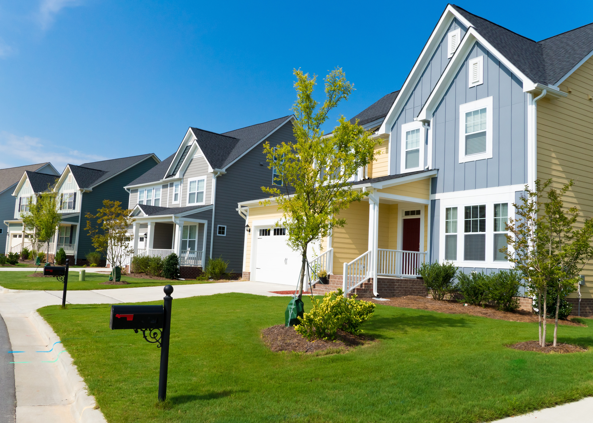 A Row of Houses With a Mailbox