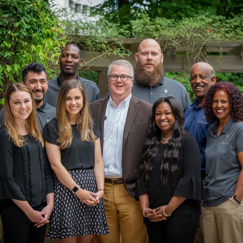 A group of people are posing for a picture together.