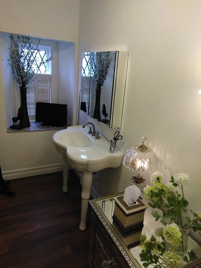 A bathroom with two sinks and a mirror