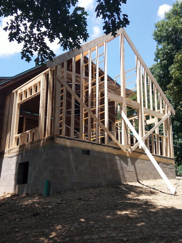 A house that is being built with a lot of wood