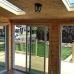 A room with sliding glass doors leading to a deck