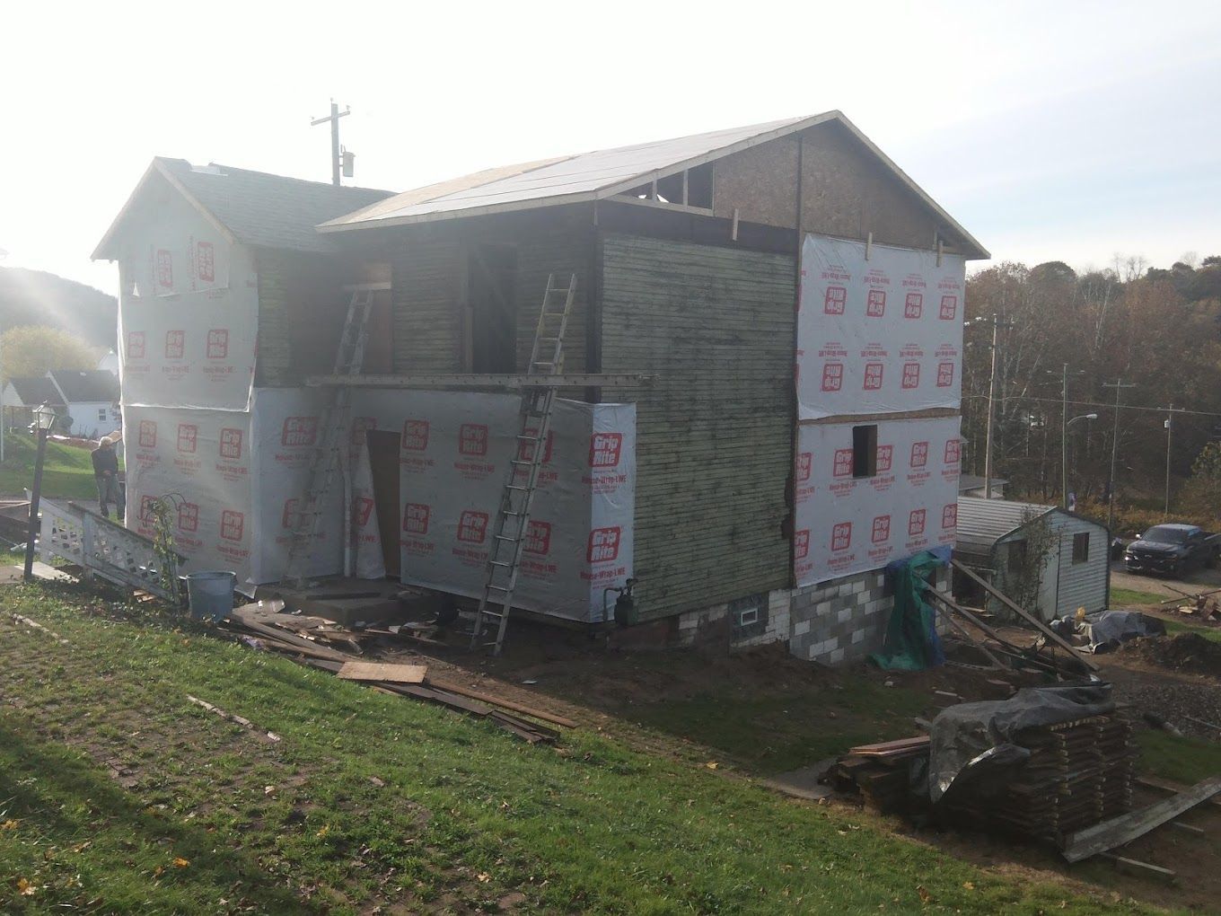 A large house is being remodeled in a rural area.