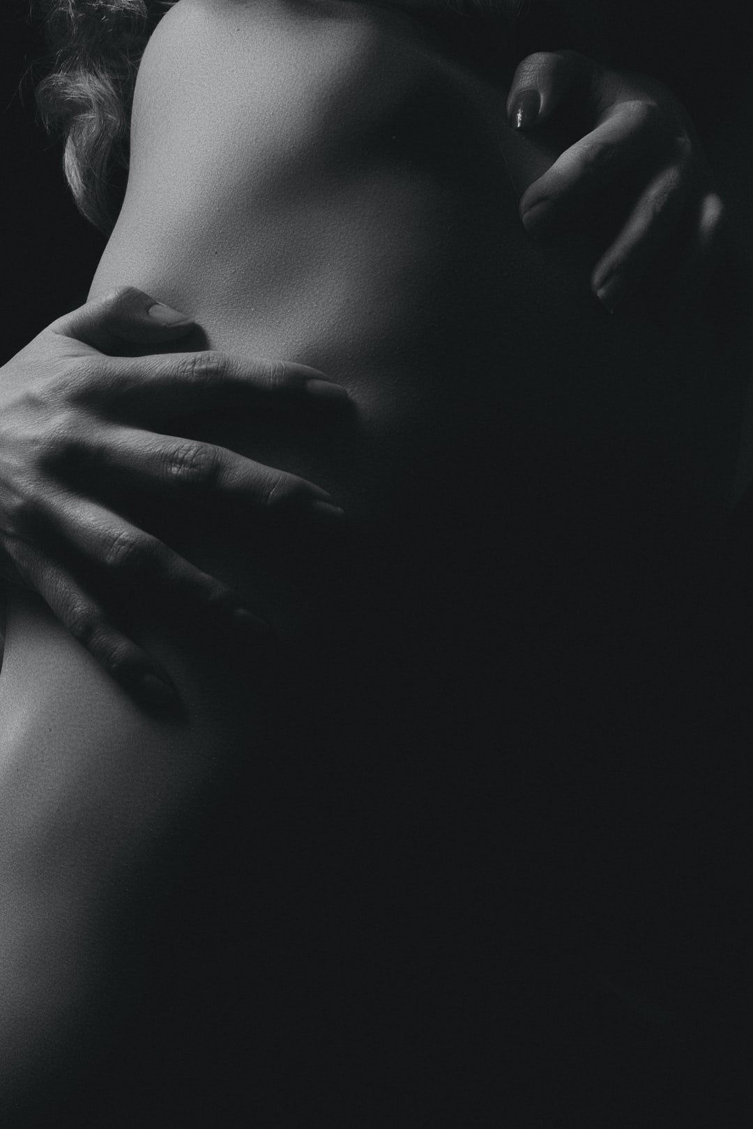 a hand gripping an arm