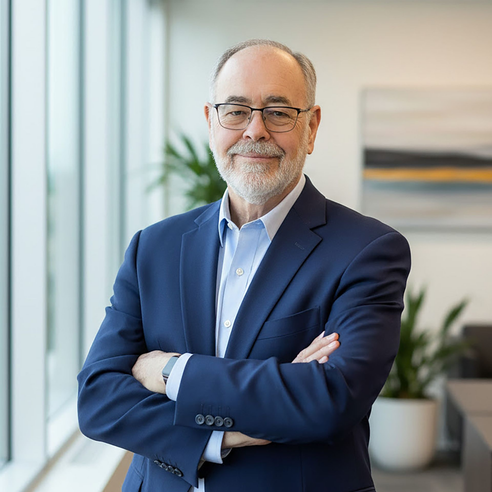 A man is standing on top of a snow covered mountain.