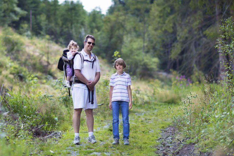 father and children hiking
