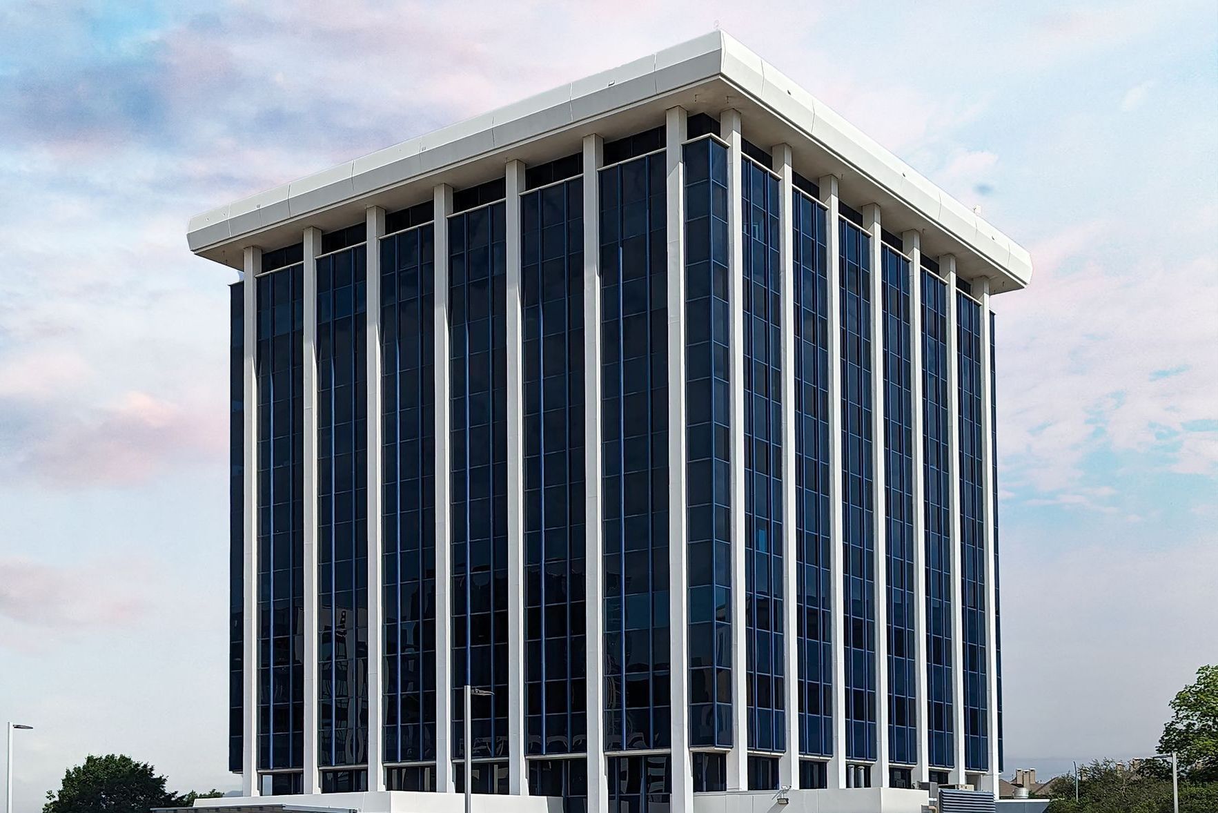 A tall building with a lot of windows and columns.