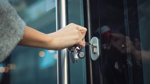 Woman Unlocking Commercial Entry Door — Saint Louis, MO — Krause Key & Lock Service