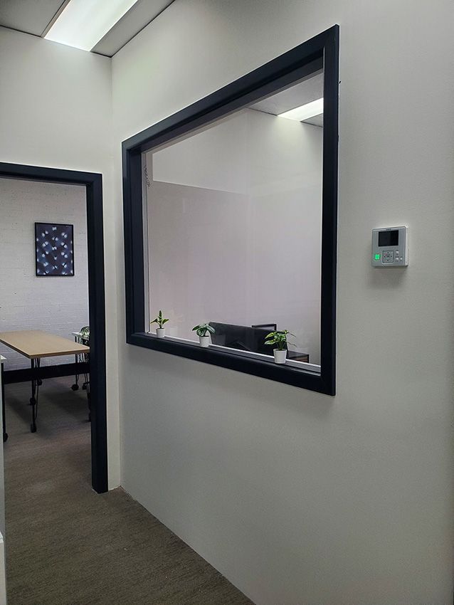 A Hallway with a Large Window — JWP Painting & Property Services in Ettalong Beach, NSW