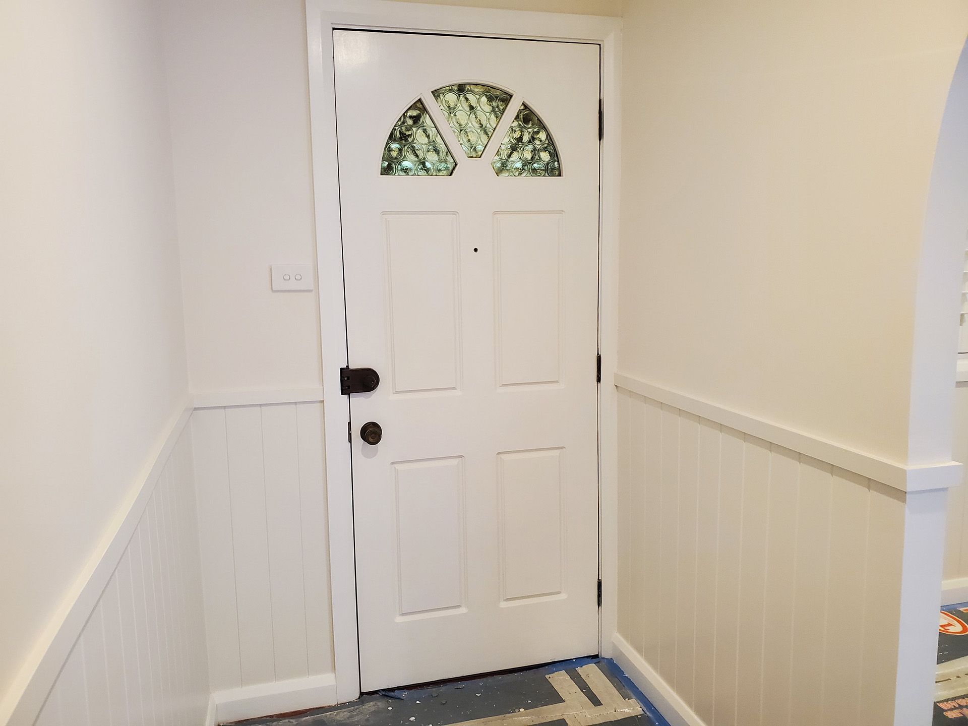 A White Door with a Stained-Glass Window — JWP Painting & Property Services in Ettalong Beach, NSW